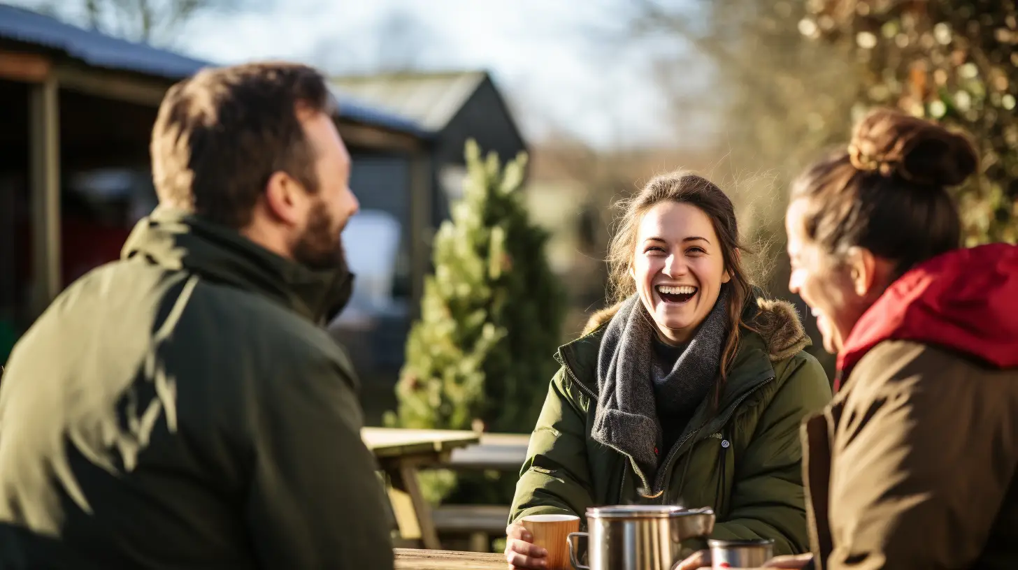 Volunteers in cozy attire enjoying a communal laugh around a campfire, highlighting the joy of connection and community wellness - Light Side Wellness Co.